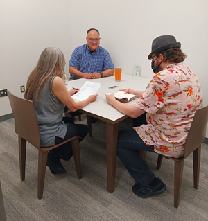 Three people at a table