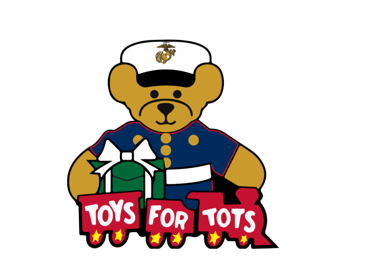 Teddy bear in military uniform with red train in front of it