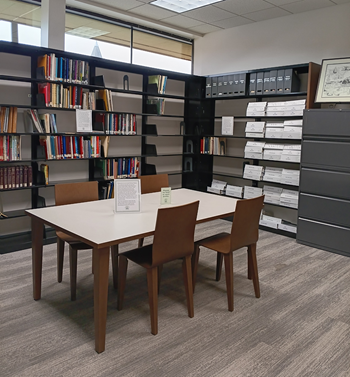 table, 4 chairs, bookshelves, cabinet